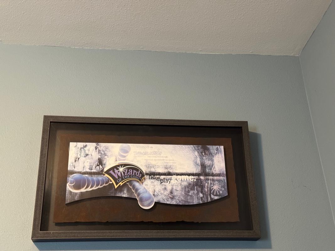 A photograph of Carol's Wizards of the Coast sign which were hung inside the offices during the time she was at the company. It now resides in her home office