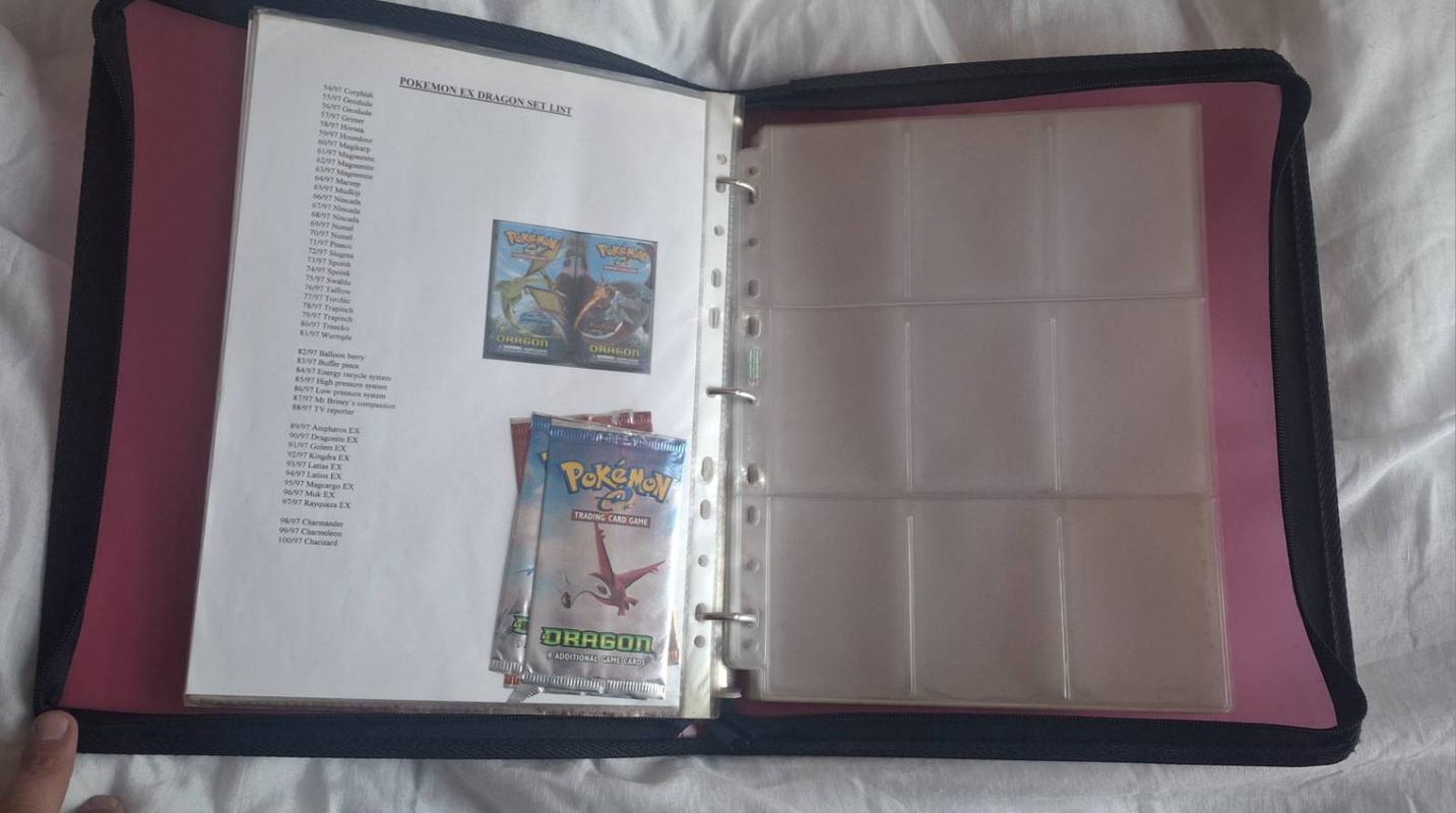 A photograph of Adam’s Pokémon TCG folder, which includes checklists of the cards he was trying to collect from back then. This page in particular features a partial list of the Pokémon EX Dragon expansion, including some empty booster packets from the set itself