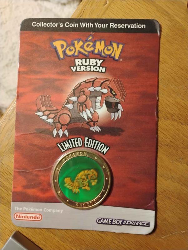 A photograph of Tallax’s Groudon collector coin, given out to him at Pokémon Rocks America in St. Louis