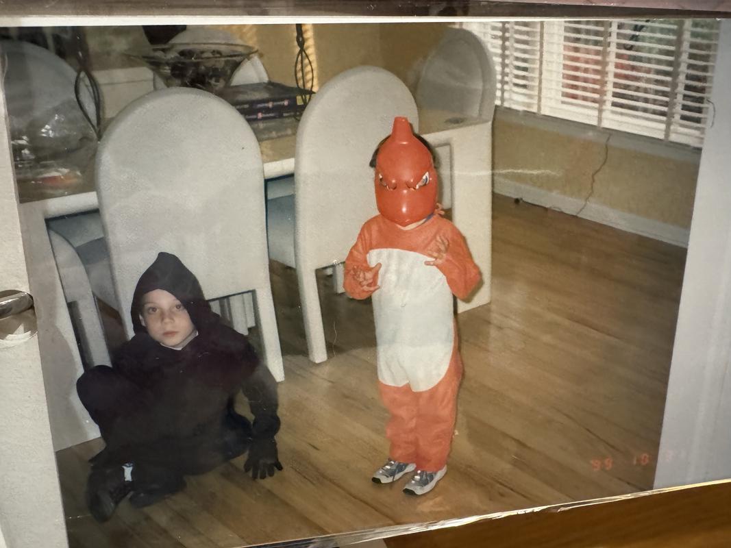 A photograph of Jed’s brothers, one in a Charmeleon costume