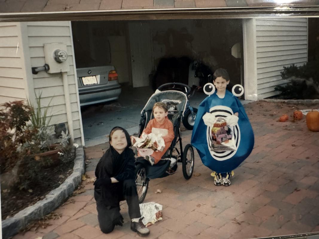 A photograph of Jed and his brothers on Halloween in 1999