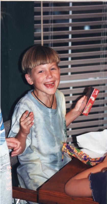 A photograph of Michael taken by his father on his seventh birthday as he opened up his gift of Pokémon Red